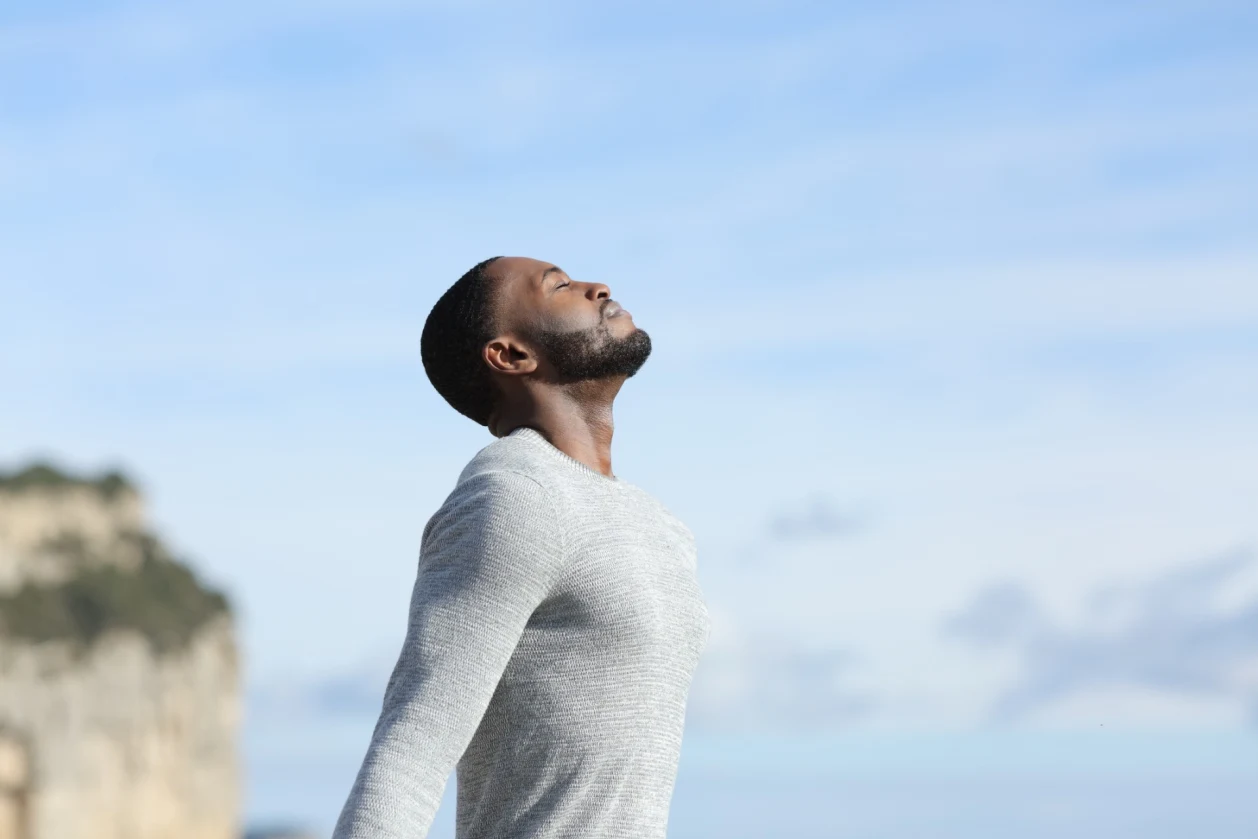 man with dark skin breathing fresh air